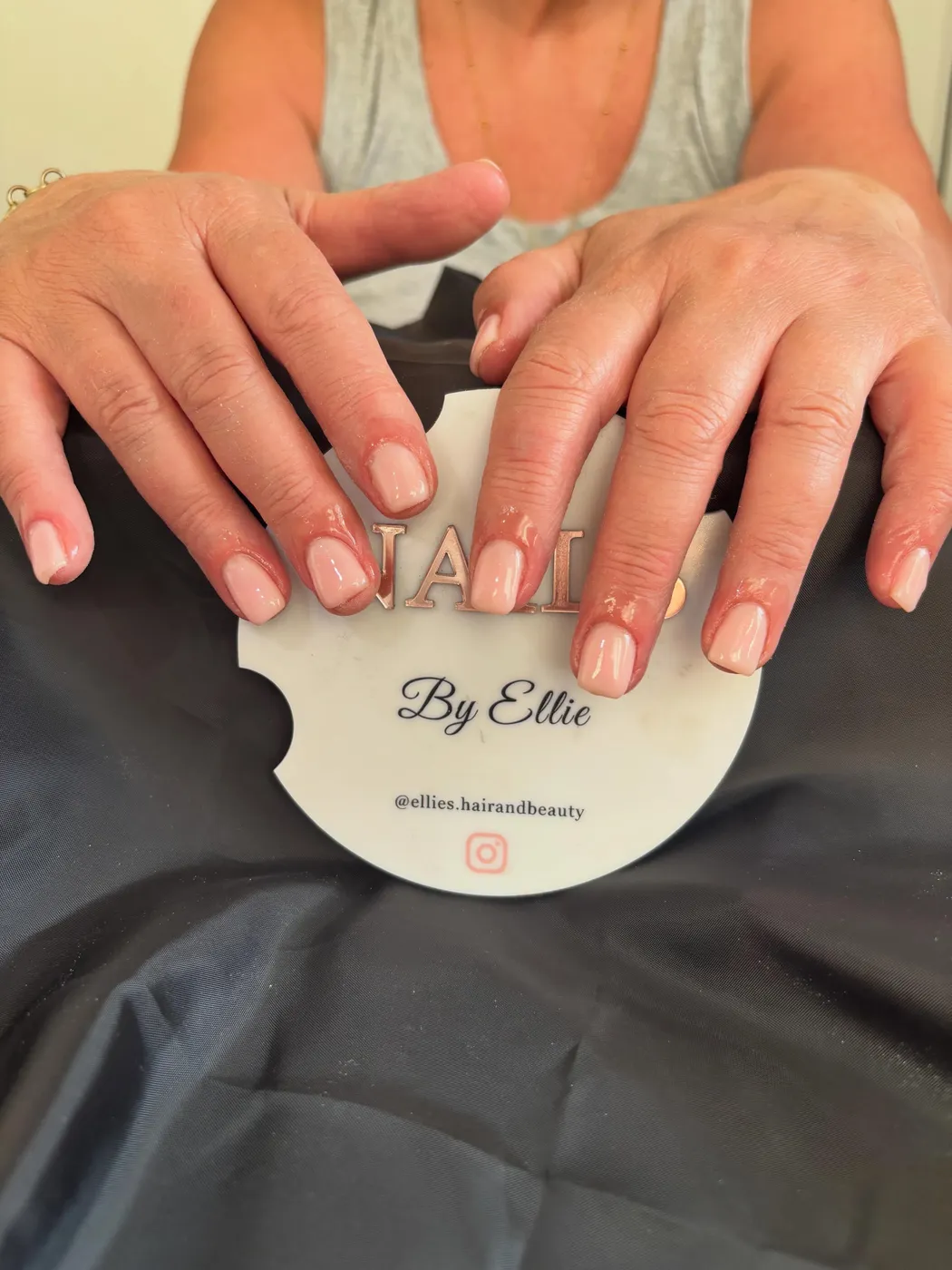 Nude pink square gel manicure with a glossy finish