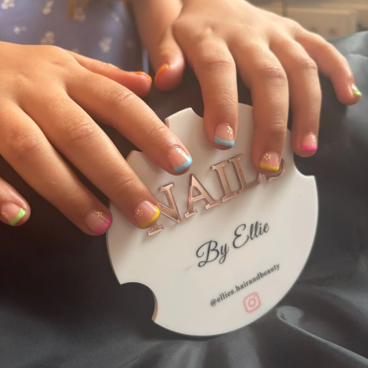 Playful rainbow French tip nail art